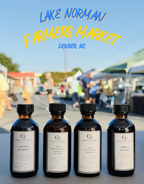 Four Charis Extracts bottles on a table at the Lake Norman Farmers Market in Denver, NC
